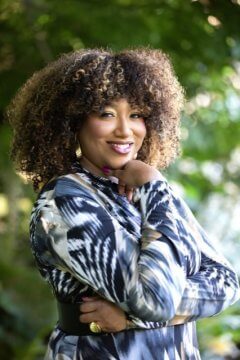 A headshot of Board member Kisha Imani Cameron