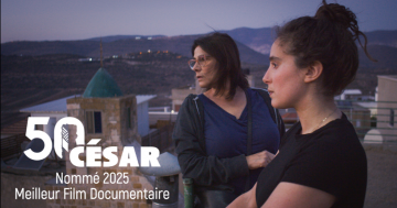 Still from "Bye Bye Tiberias" with the mom and daughter overlooking the city together, featuring the logo for the 50th Cesar Awards